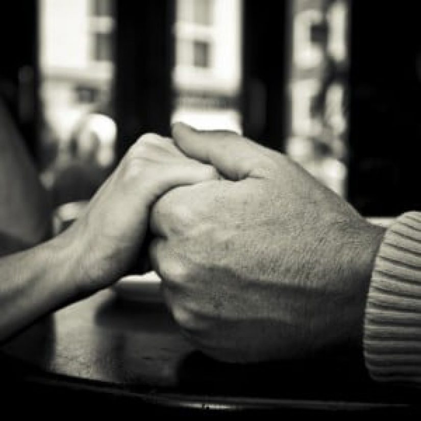 photo of people holding hands